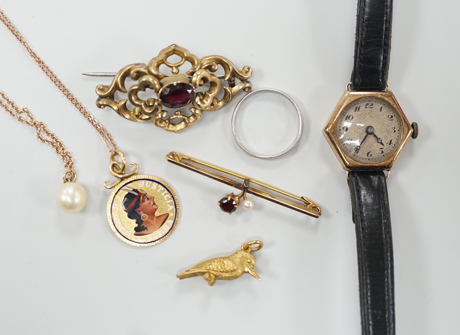 A platinum wedding band, 2.3 grams, a 9ct gold, garnet and seed pearl set bar brooch, a bird charm, a yellow metal and enamelled pendant on a 9ct chain, a 9ct and cultured pearl pendant necklace, a lady's 9ct gold hexago